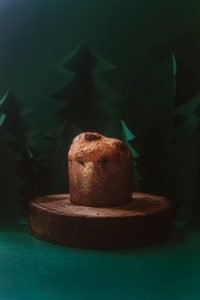panettone bread on round wooden board