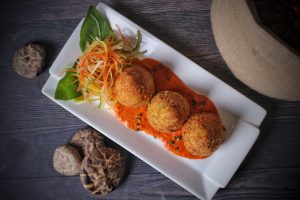 arancini with sauce and vegetables