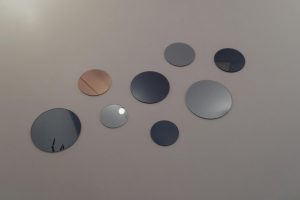 round mirrors hanging on the wall