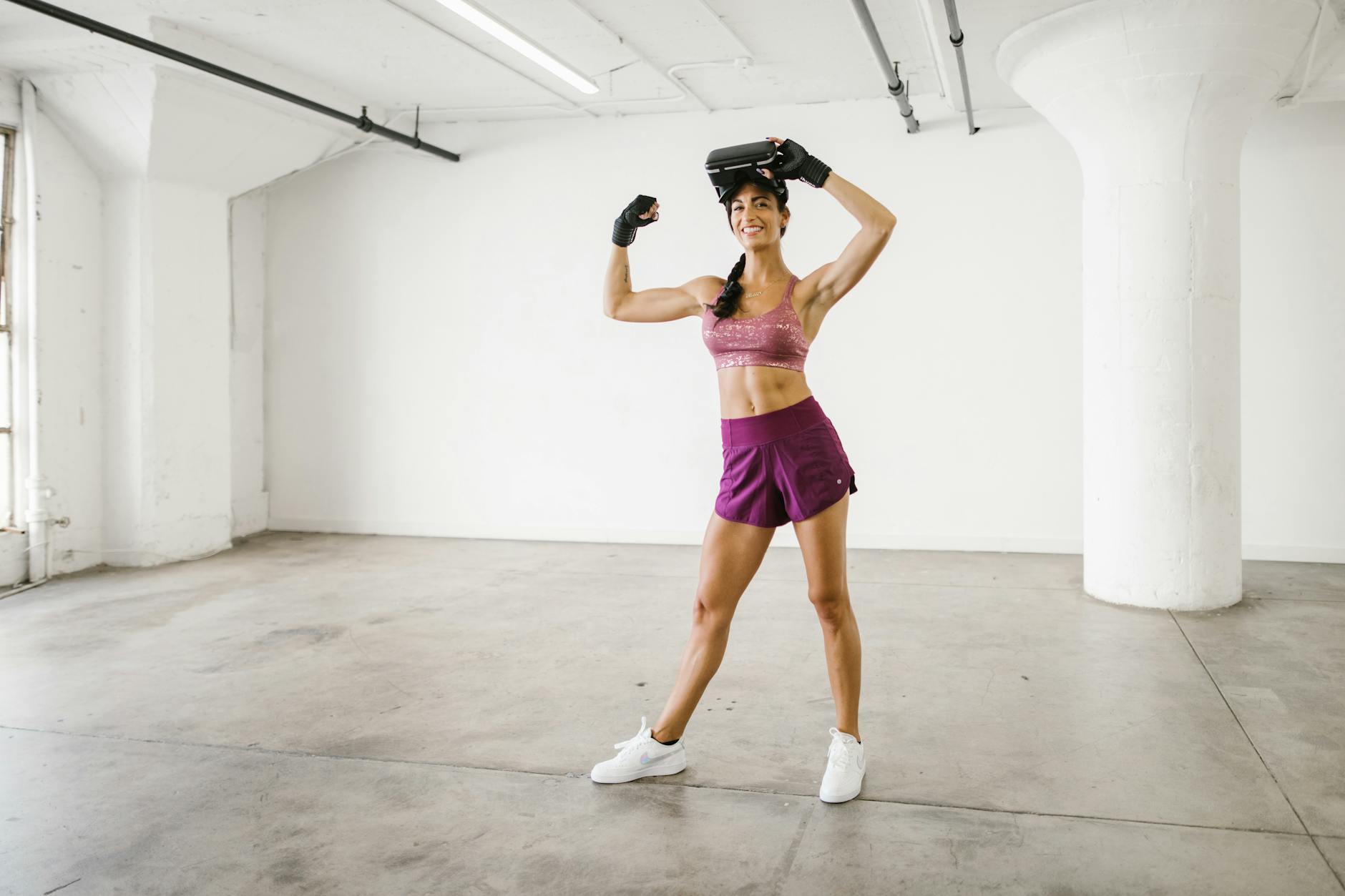 woman in purple activewear with a virtual reality headset