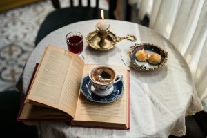 cozy coffee and book on elegant table setting