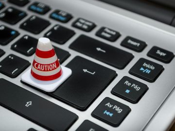 white caution cone on keyboard
