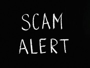 scam alert letting text on black background